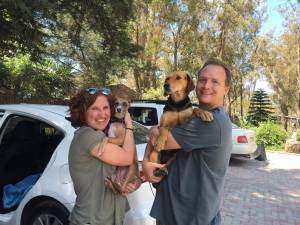 man, woman, two dogs